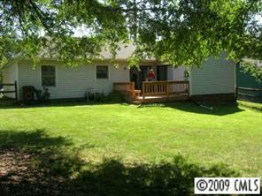 12616 Newstead Road Huntersville, NC 28078 - Photo 6 of 8 a view of a house with a yard and tree