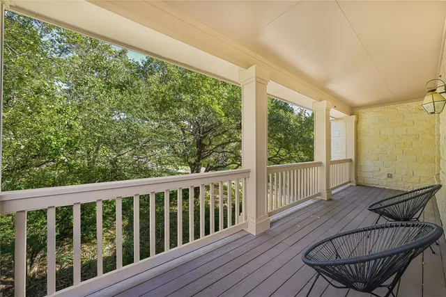 a view of balcony with wooden floor