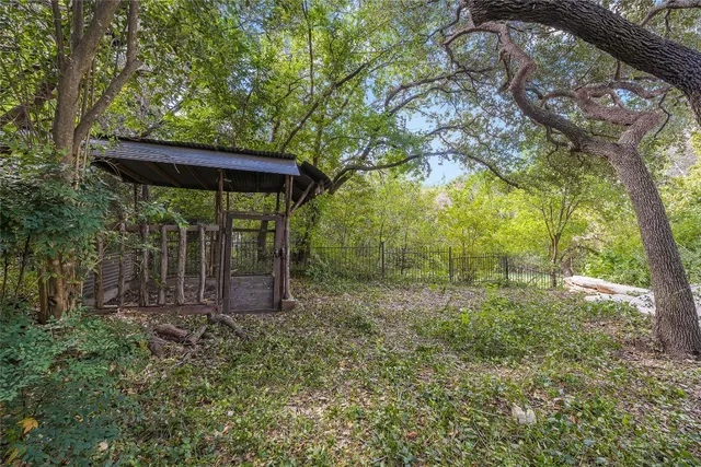 a view of a backyard with a small cabin