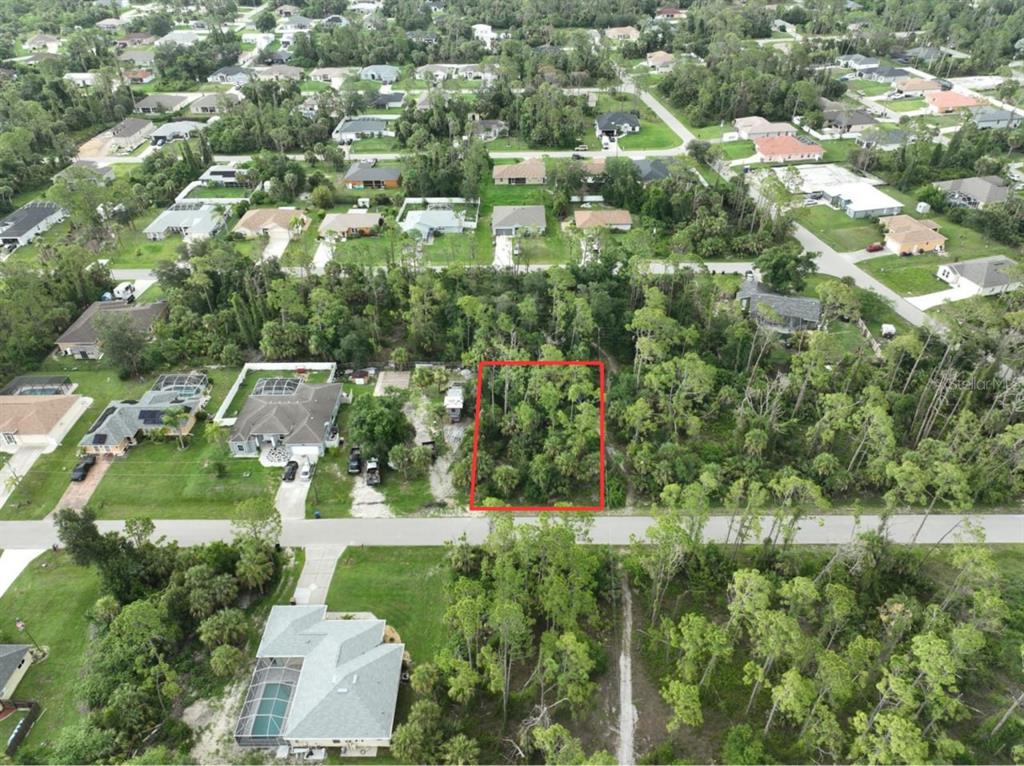 Calabash Ln Port North Port, FL 34286 - Photo 1 of 1 an aerial view of residential houses with outdoor space and trees