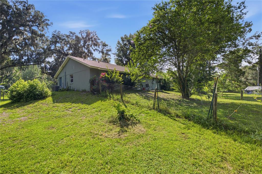 17900 Northwest 120th Avenue Road Reddick, FL 32686 - Photo 18 of 45 a backyard of a house with lots of green space