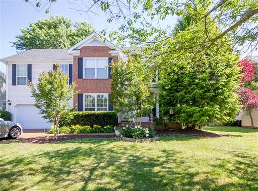 1766 Witt Way Drive Spring Hill, TN 37174 - Photo 1 of 13 a front view of a house with a yard