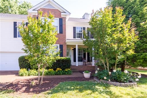 1766 Witt Way Drive Spring Hill, TN 37174 - Photo 2 of 13 a front view of a house with garden
