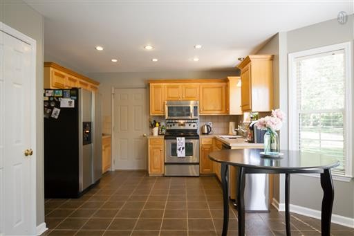 1766 Witt Way Drive Spring Hill, TN 37174 - Photo 8 of 13 a kitchen with stainless steel appliances granite countertop a refrigerator a stove top oven a sink and dishwasher