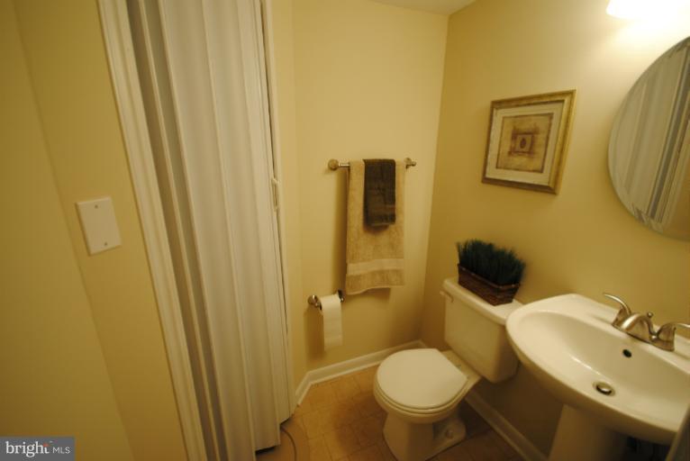 6206 Radecke Avenue Baltimore, MD 21206 - Photo 2 of 22 a white toilet sitting next to a bathroom sink