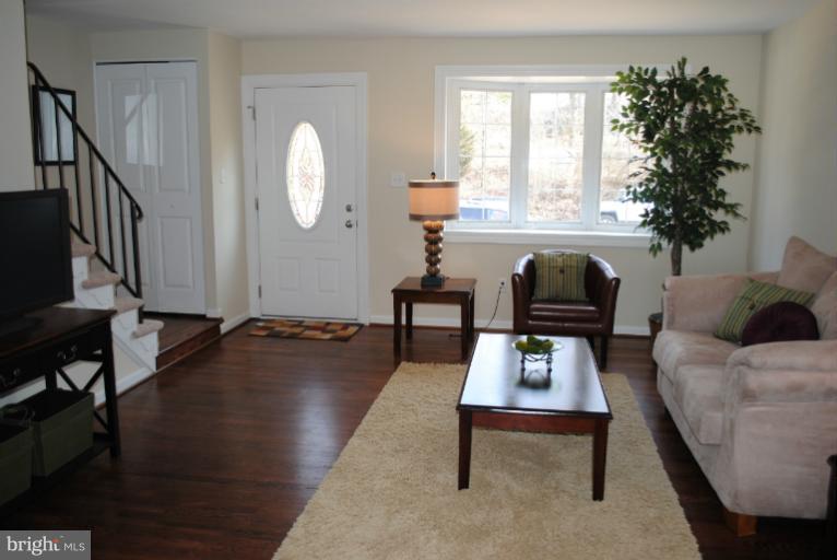 6206 Radecke Avenue Baltimore, MD 21206 - Photo 15 of 22 a living room with furniture a window and a potted plant