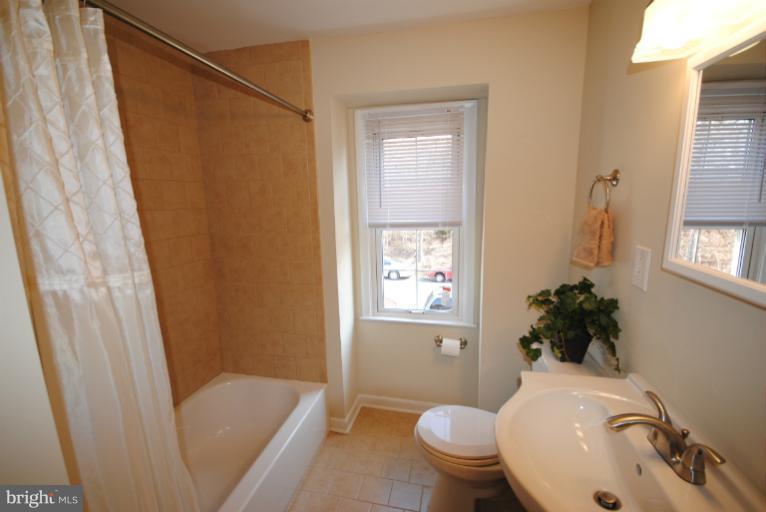 6206 Radecke Avenue Baltimore, MD 21206 - Photo 3 of 22 a bathroom with a sink toilet and shower
