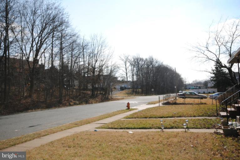 6206 Radecke Avenue Baltimore, MD 21206 - Photo 21 of 22 a backyard of a house with trees and houses