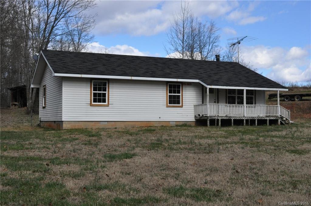 527 Floyd Blackwell Road, Unit A Tryon, NC 28782 - Photo 3 of 13 a view of a house with a yard