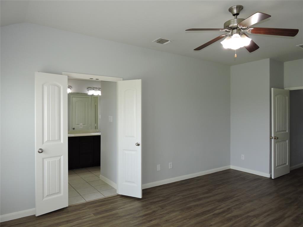 8050 Privet Street Forney, TX 75126 - Photo 11 of 24 This room features wood-look flooring and light gray walls