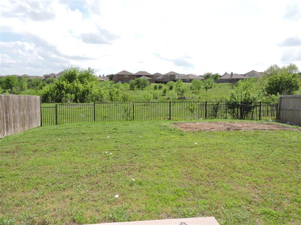 8050 Privet Street Forney, TX 75126 - Photo 22 of 24 The property features a fenced backyard with a lawn