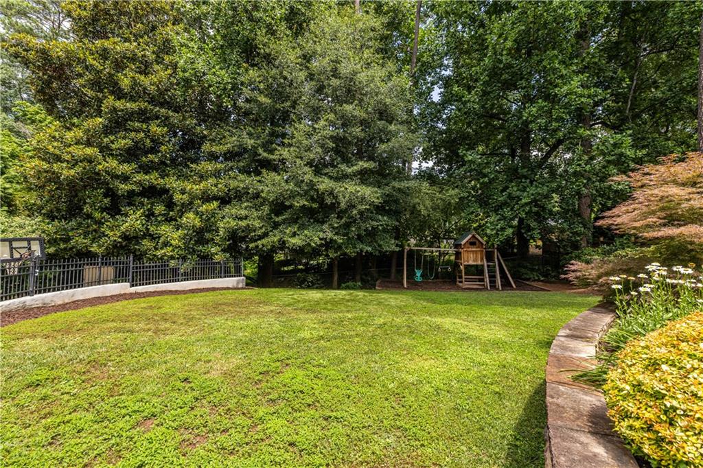 1890 Silvastone Drive Decatur, GA 30033 - Photo 41 of 48 a swimming pool with trees in the background