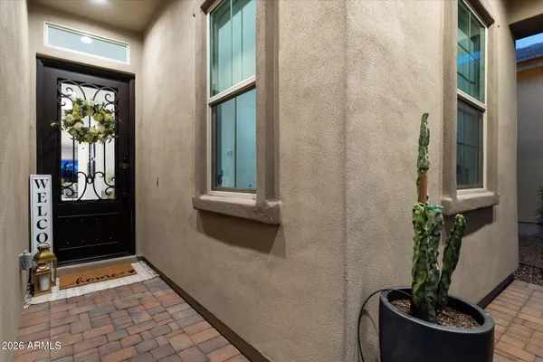 a view of a patio with a dining table and chairs with a table and chairs
