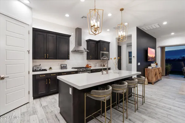 a view of a house with backyard porch and sitting area