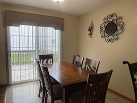 574 Boulder Drive Morris, IL 60450 - Photo 5 of 14 a view of a dining room with furniture and wooden floor