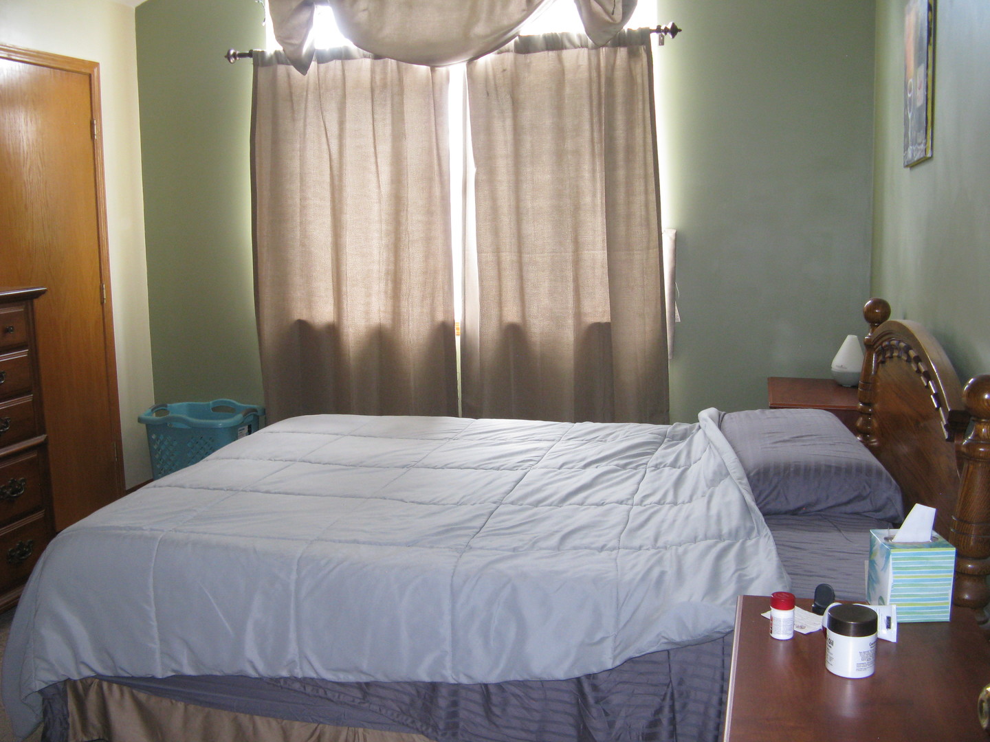 574 Boulder Drive Morris, IL 60450 - Photo 9 of 14 a bedroom with a bed and a chandelier