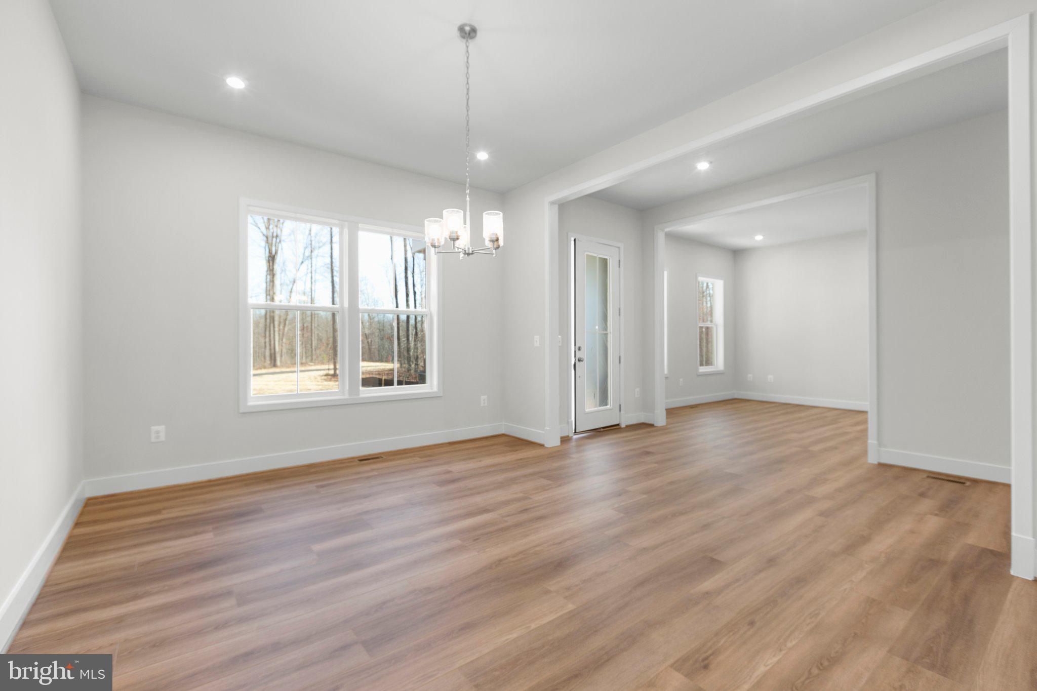 10 Burwell Road Nokesville, VA 20181 - Photo 40 of 57 a view of an empty room with wooden floor and a window