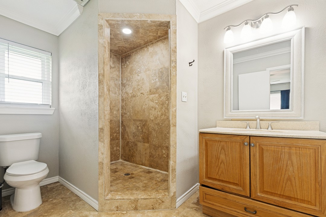 2500 County Road 62 Rosharon, TX 77583 - Photo 29 of 48 a bathroom with a sink a toilet and shower