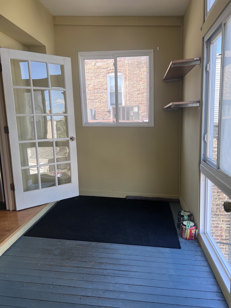 Undisclosed Address Chicago, IL 60622 - Photo 16 of 16 an empty room with wooden floor and windows