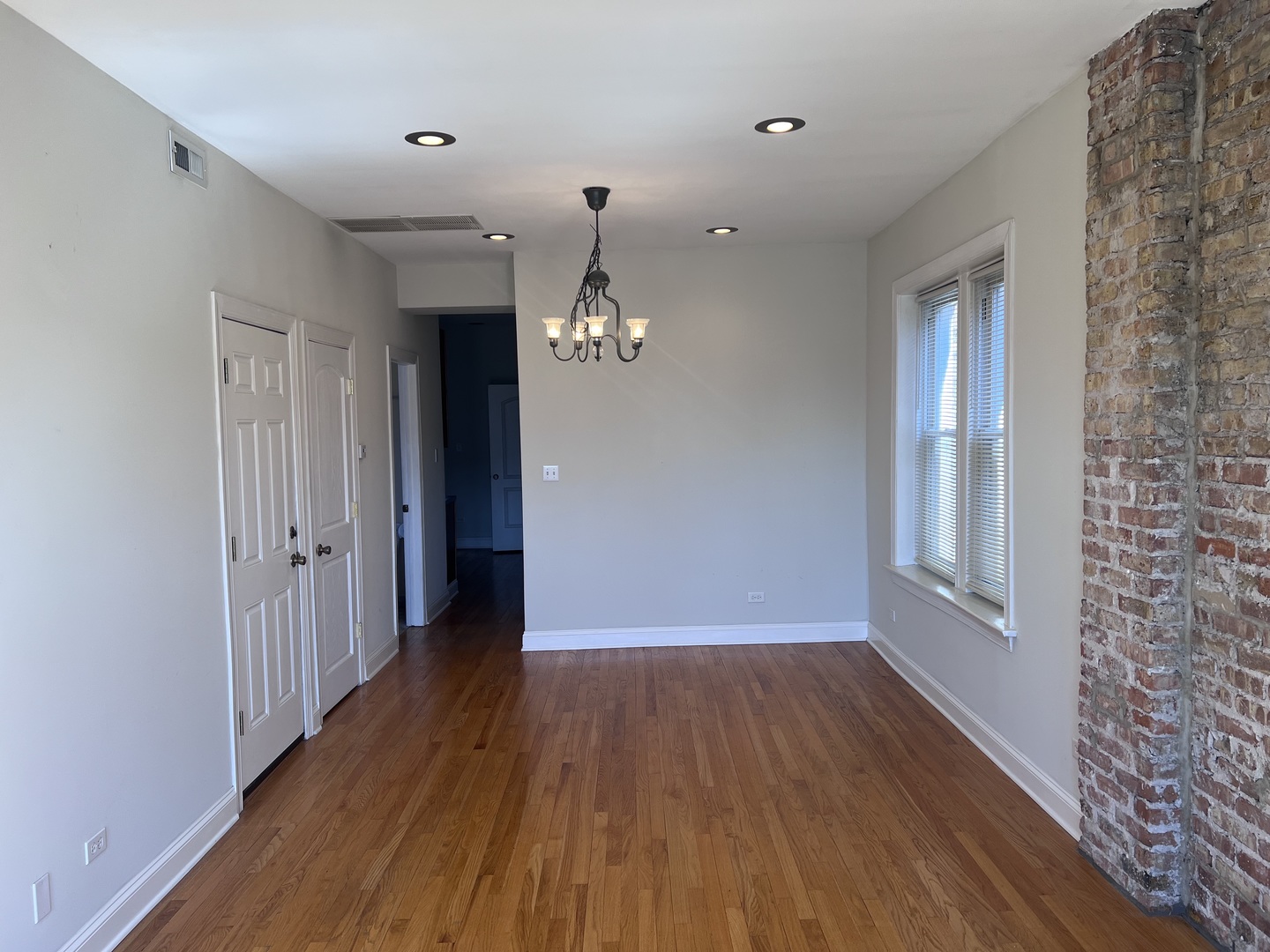 Undisclosed Address Chicago, IL 60622 - Photo 7 of 16 wooden floor in an empty room with a window