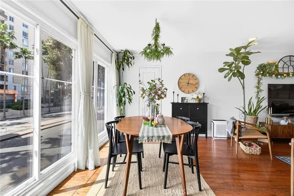 a kitchen with stainless steel appliances granite countertop a stove top oven a sink dishwasher and microwave with cabinets