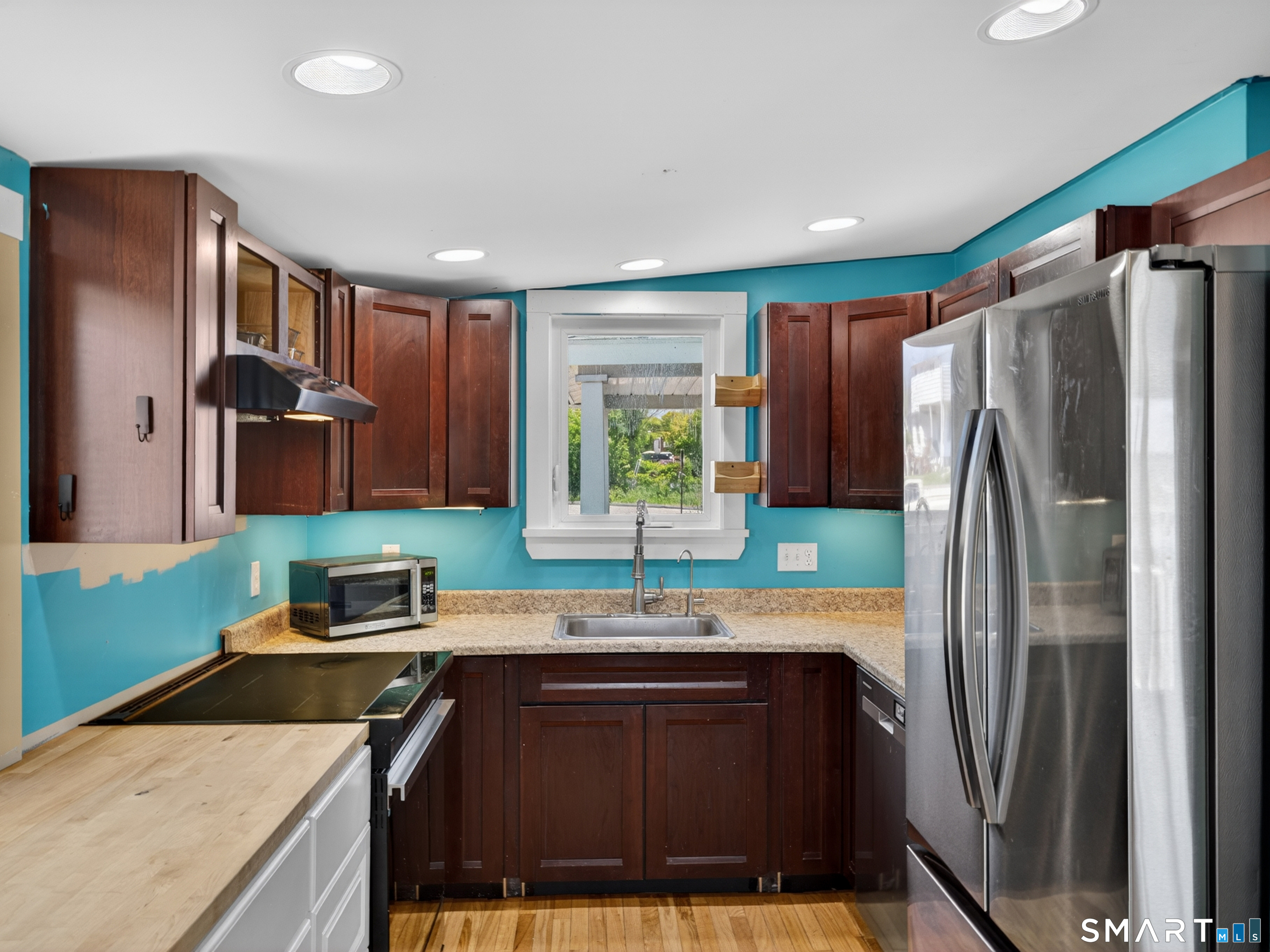 13 Oak Street Groton, CT 06340 - Photo 15 of 38 a kitchen with stainless steel appliances granite countertop a refrigerator and a sink