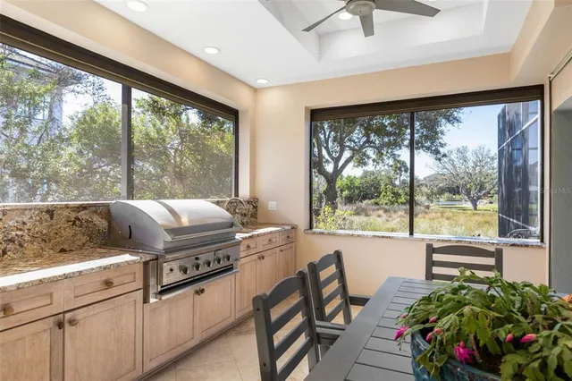 a view of a swimming pool with a table and chairs