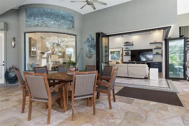 a bedroom with a bed lamp and a large window