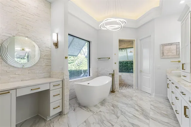 an aerial view of a houses with a lake view