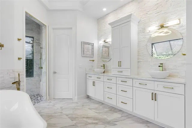 an aerial view of a houses with a lake view