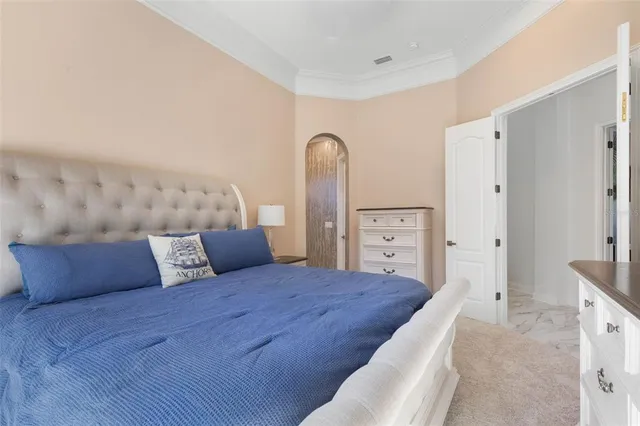 a view of a patio with a table and chairs under an umbrella