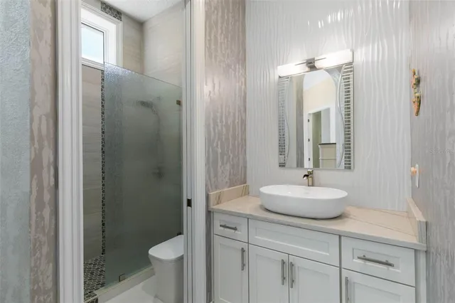 a building outdoor space with patio furniture and potted plants