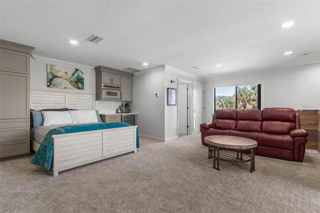 a view of a patio with table and chairs a barbeque