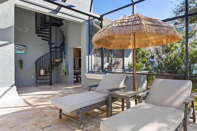 a front view of house with yard and outdoor seating