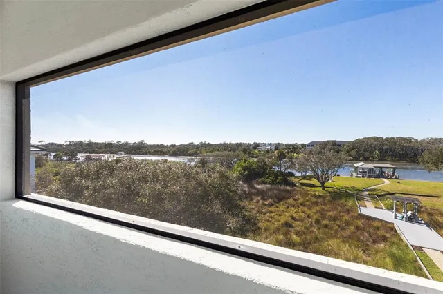 an aerial view of a house with a swimming pool yard and outdoor seating