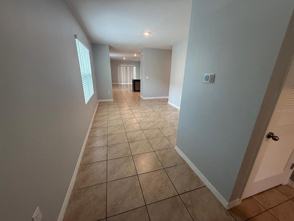 754 Chinoy Road Davenport, FL 33837 - Photo 5 of 26 a view of hallway with window
