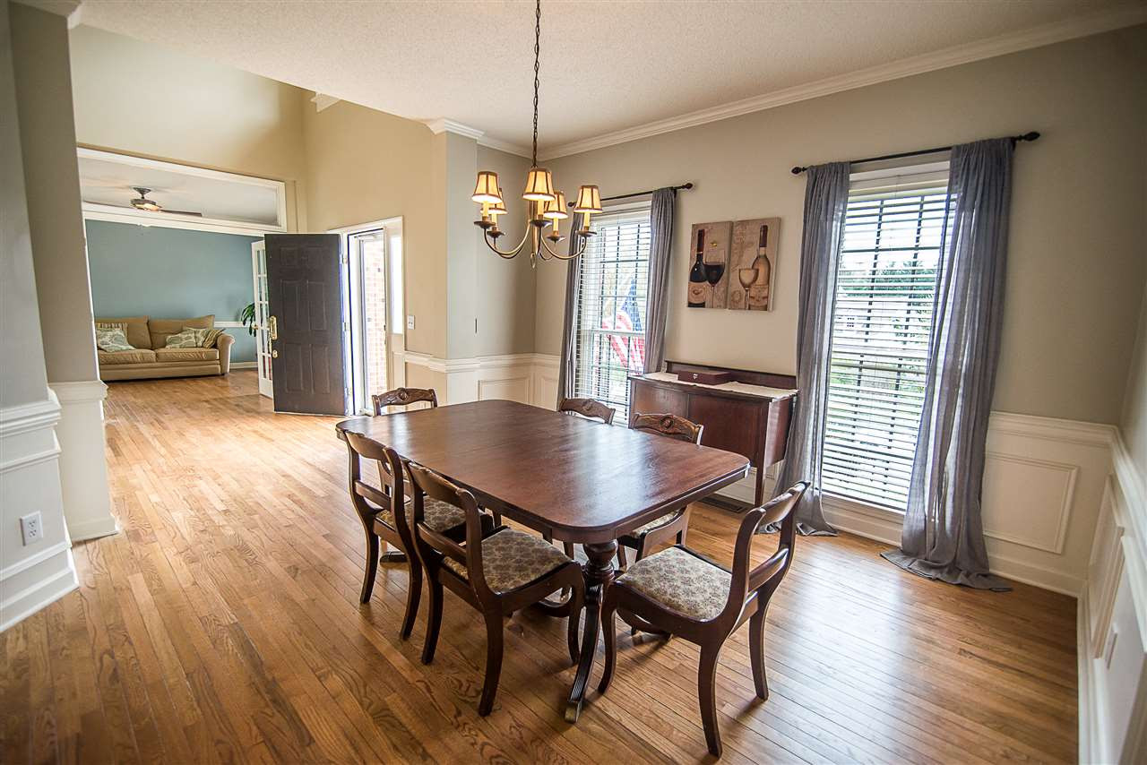 5204 Camfirth Way Raleigh, NC 27613 - Photo 4 of 21 Craftsmanship with Wainscoting and chair rail Formal Dining