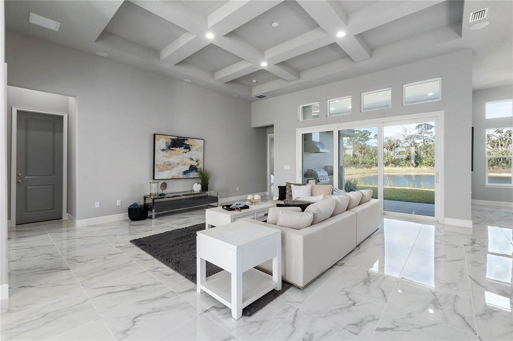29 Coronado Road Flagler Beach, FL 32136 - Photo 11 of 81 a living room with furniture and a large window