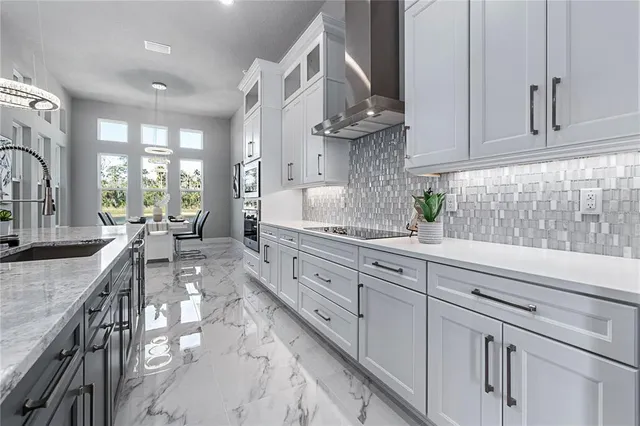a bathroom with a shower toilet sink and double vanity