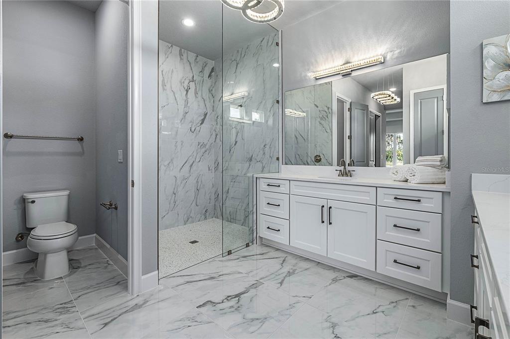 29 Coronado Road Flagler Beach, FL 32136 - Photo 29 of 81 a bathroom with a shower toilet sink and double vanity
