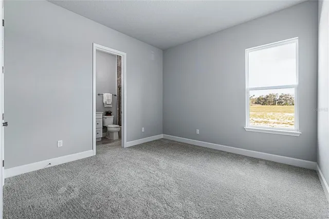 a view of a house with a garden and yard