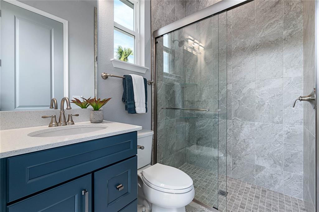29 Coronado Road Flagler Beach, FL 32136 - Photo 36 of 81 a bathroom with a sink toilet a mirror and shower