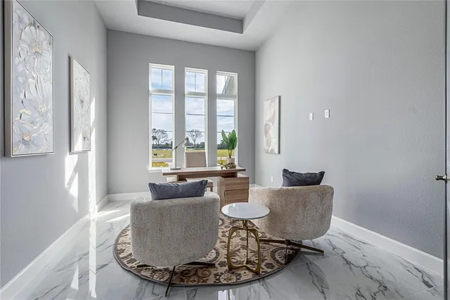 a front view of a house with a garden and plants