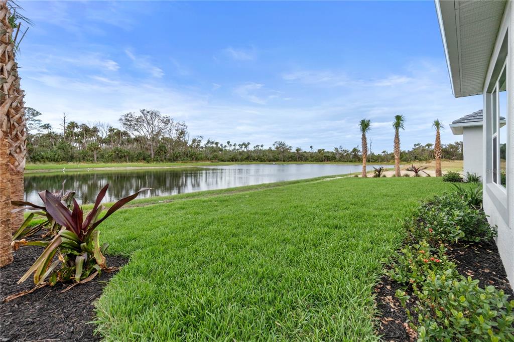 29 Coronado Road Flagler Beach, FL 32136 - Photo 47 of 81 a view of a lake with a big yard and a large trees