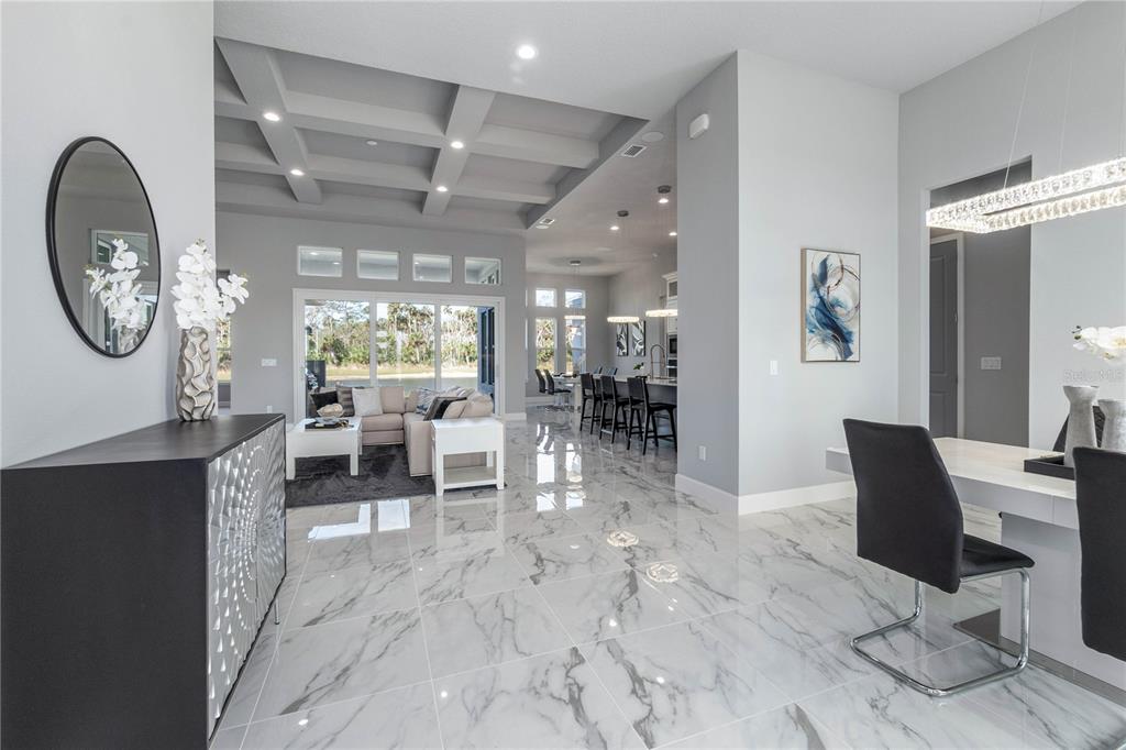 29 Coronado Road Flagler Beach, FL 32136 - Photo 5 of 81 a living room with furniture a table and large windows