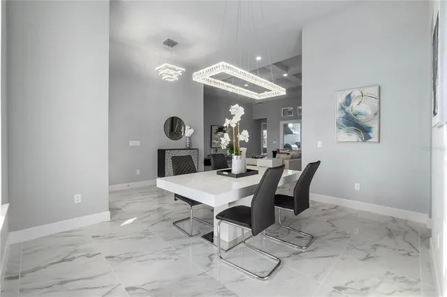 a living room with furniture wooden floor and a large window