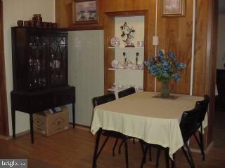 8513 Newark Road Newark, MD 21841 - Photo 2 of 14 a dining room with table and chair