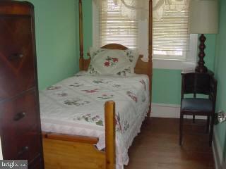 8513 Newark Road Newark, MD 21841 - Photo 12 of 14 a bedroom with a bed and a window