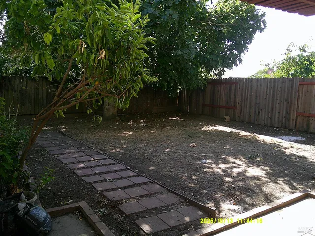 a backyard of a house with lots of green space