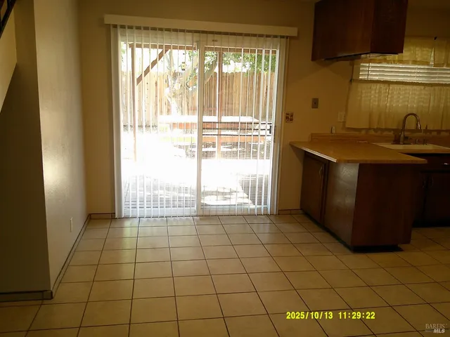 a view of a kitchen with a sink